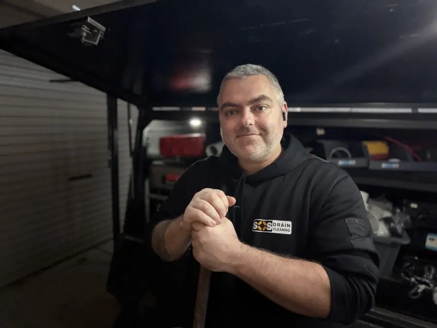 Aaron, licensed plumber and owner-operator of SOS Drain Cleaning
