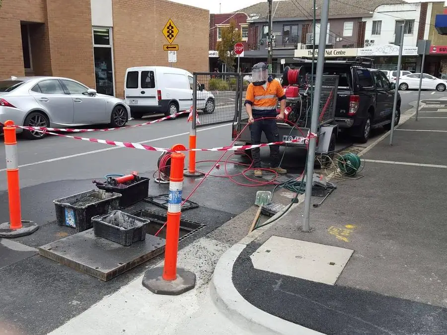 SOS Drain Cleaning clearing a commercial stormwater drain